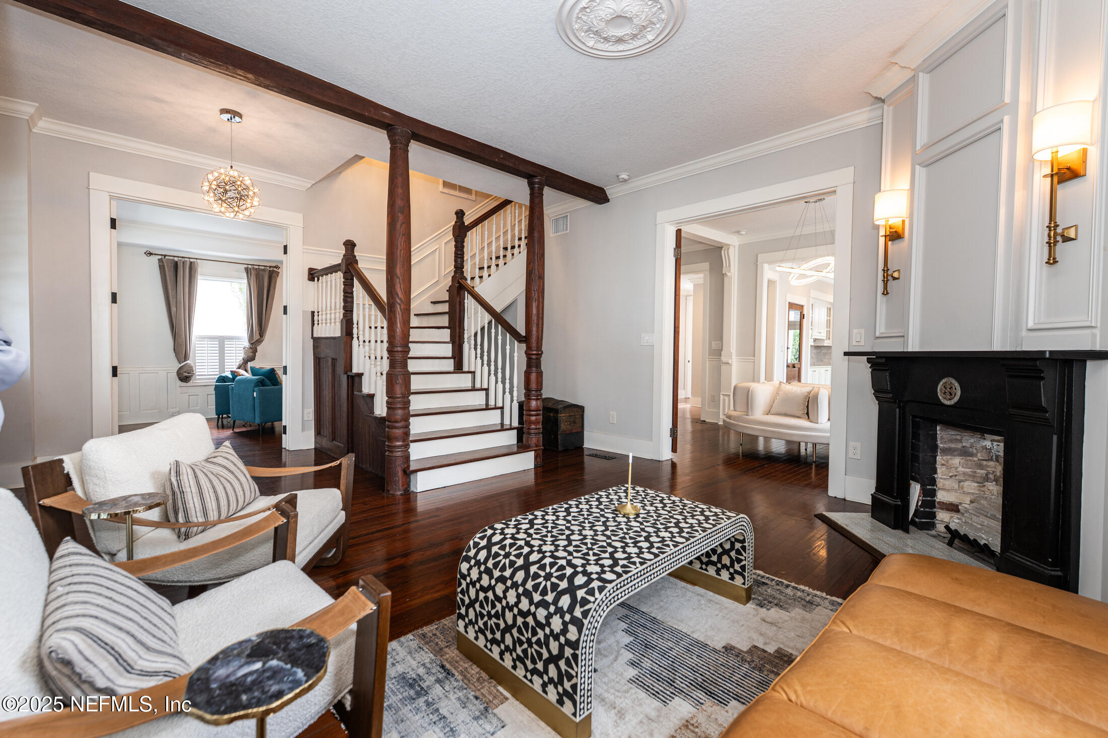 56 Water Street St. Augustine, FL 32084 - Photo 9 of 61 a living room with furniture and a fireplace