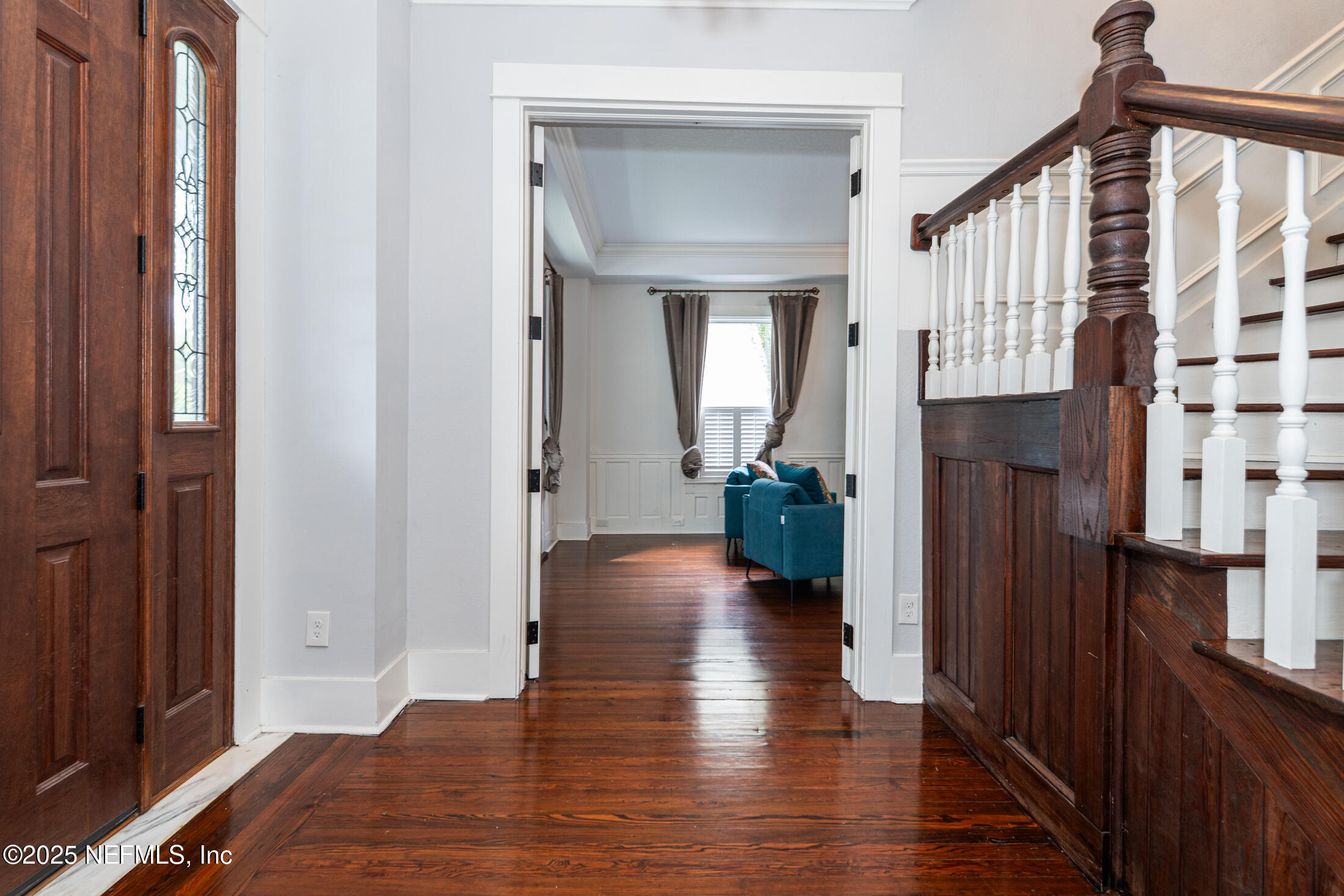 56 Water Street St. Augustine, FL 32084 - Photo 10 of 61 a view of a hallway with wooden floor and staircase