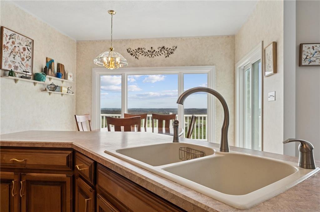 11 Stolze Road Burgettstown, PA 15021 - Photo 17 of 47 a kitchen with a sink a counter and a dining table