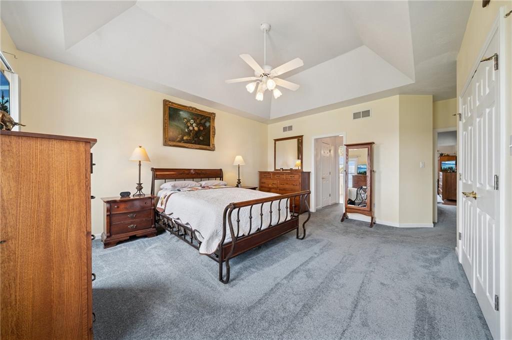 11 Stolze Road Burgettstown, PA 15021 - Photo 21 of 47 a spacious bedroom with a bed and a chandelier