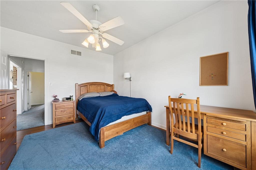 11 Stolze Road Burgettstown, PA 15021 - Photo 23 of 47 a spacious bedroom with a bed and a chandelier