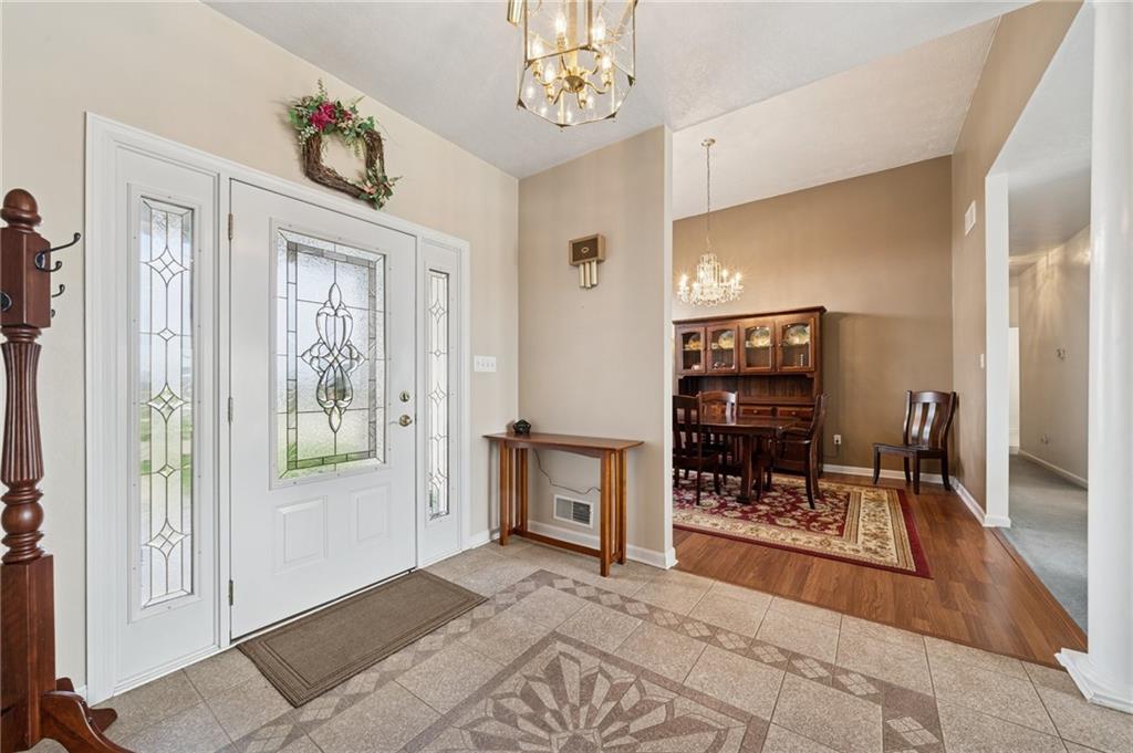 11 Stolze Road Burgettstown, PA 15021 - Photo 7 of 47 a view of a livingroom with a dinning area hardwood floor and a ceiling fan