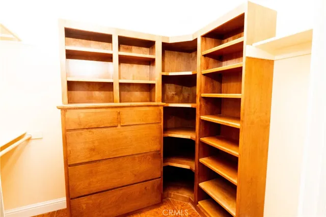 a bathroom with a tub a sink and glass door