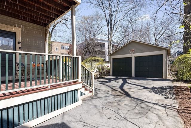 a view of a brick house with a large window