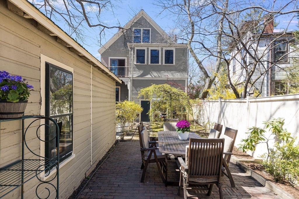 10 Howland Street Cambridge, MA 02138 - Photo 14 of 14 a view of a house with patio and wooden floor
