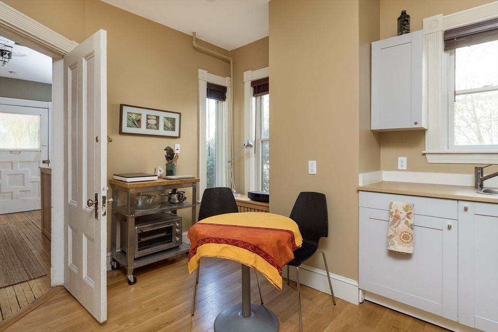 10 Howland Street Cambridge, MA 02138 - Photo 3 of 14 a bedroom with furniture and a window