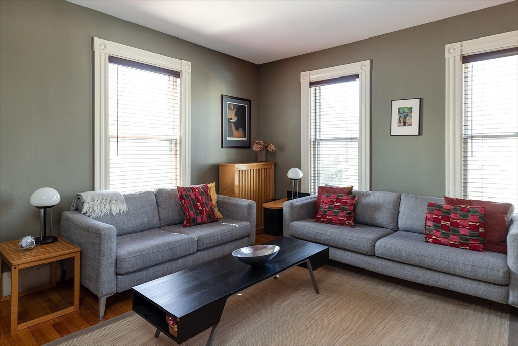 10 Howland Street Cambridge, MA 02138 - Photo 7 of 14 a living room with furniture and a window