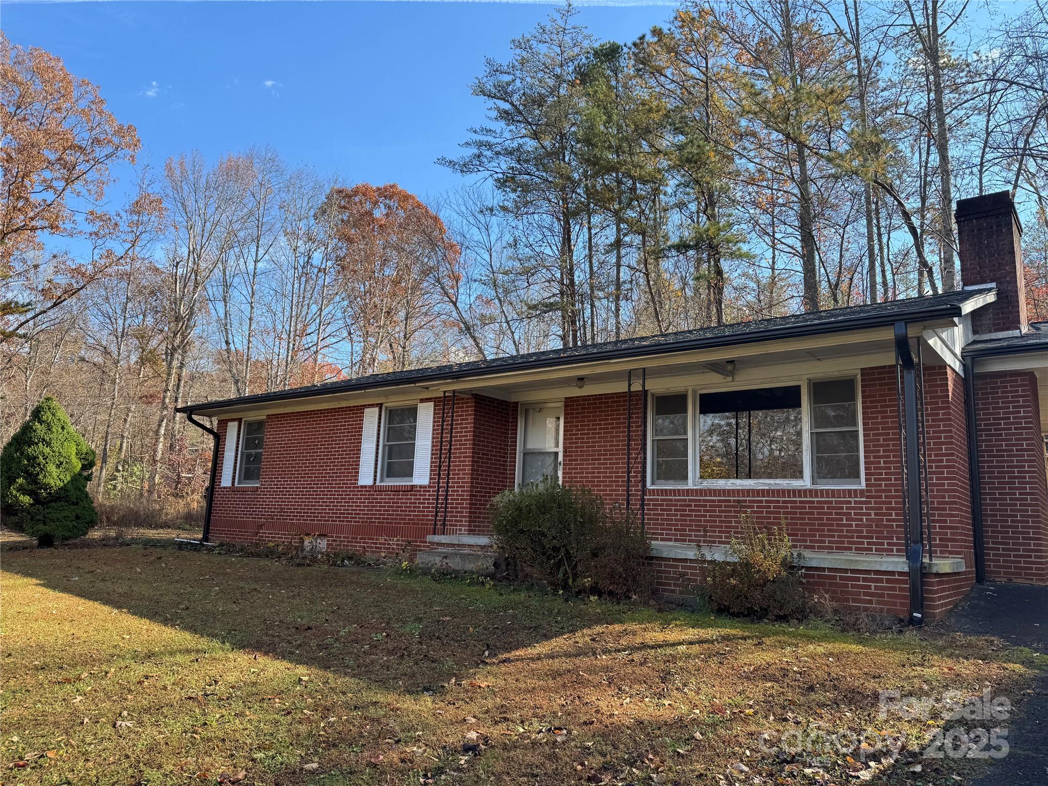5046 Old Linville Road Marion, NC 28752 - Photo 2 of 8 a front view of a house with garden