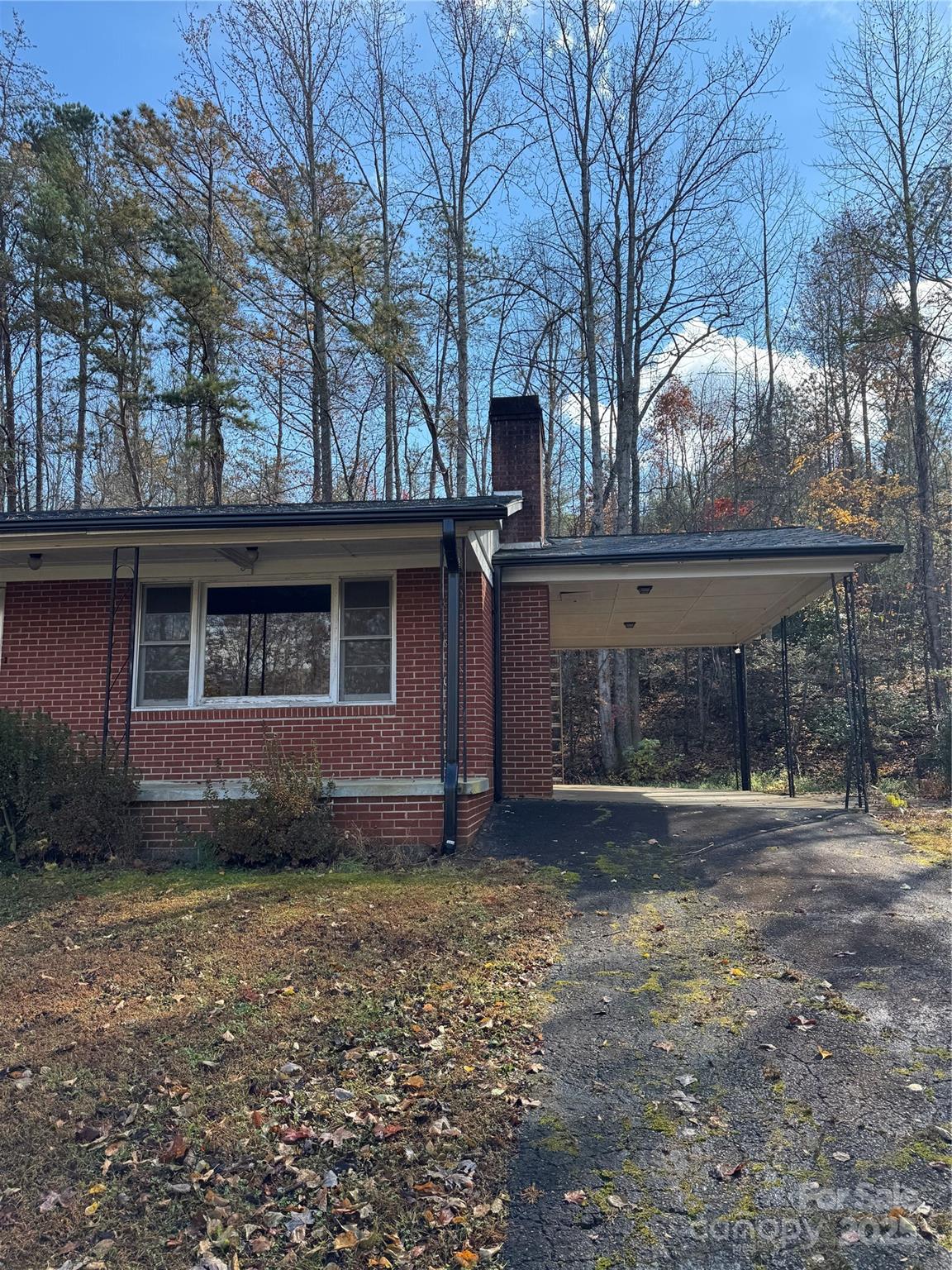 5046 Old Linville Road Marion, NC 28752 - Photo 3 of 8 a front view of a house with garden