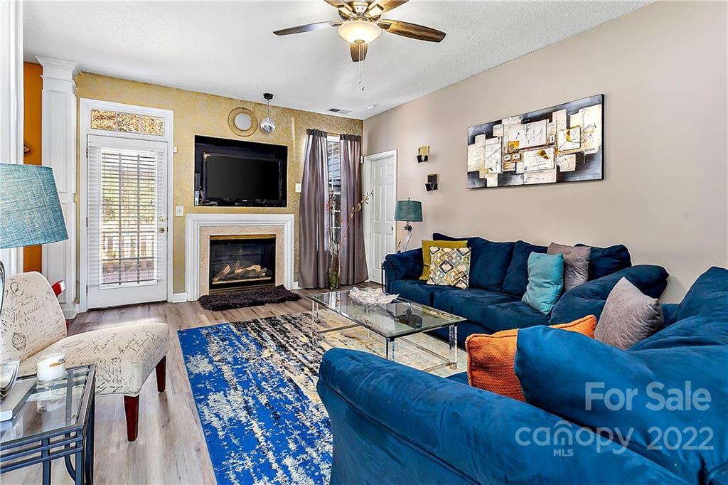 2220 Meadecroft Road Charlotte, NC 28214 - Photo 5 of 16 a living room with furniture fireplace and flat screen tv