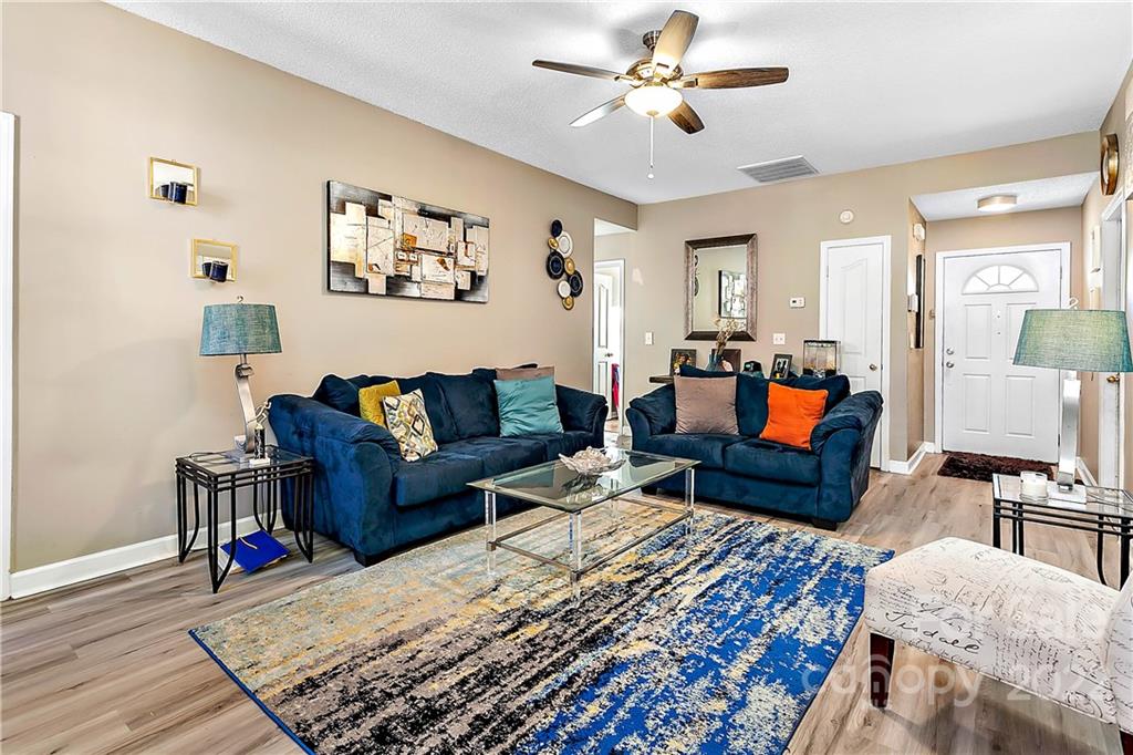 2220 Meadecroft Road Charlotte, NC 28214 - Photo 6 of 16 a living room with furniture and wooden floor