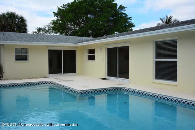 220 Puritan Road West Palm Beach, FL 33405 - Photo 4 of 10 a house view with a swimming pool