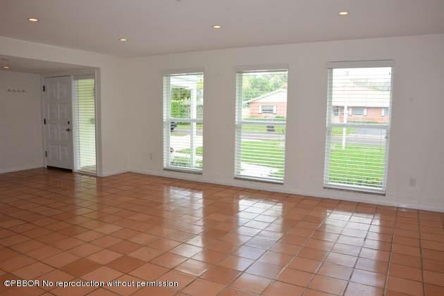 220 Puritan Road West Palm Beach, FL 33405 - Photo 7 of 10 a view of an empty room with window and a kitchen