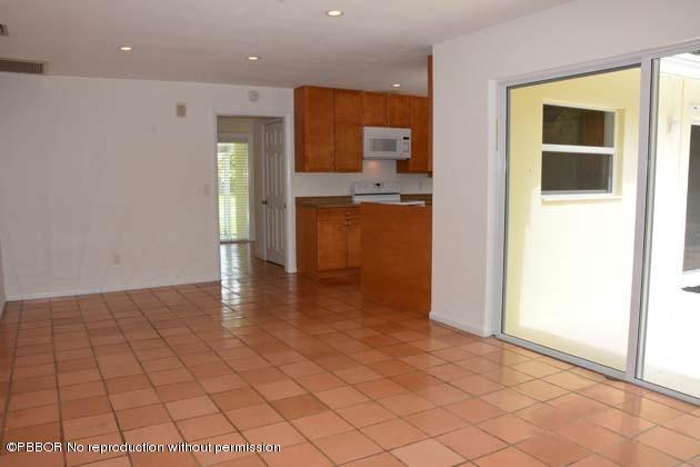 220 Puritan Road West Palm Beach, FL 33405 - Photo 8 of 10 a view of a hallway with wooden floor and a living room