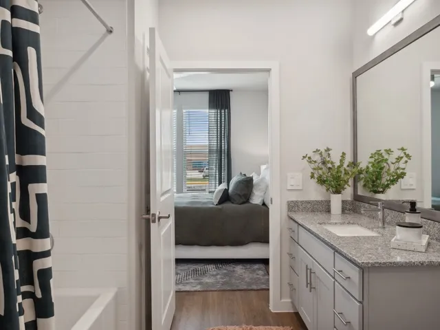 a kitchen with a sink and a mirror