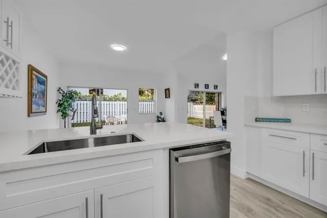 a bedroom with a bed window and a dresser