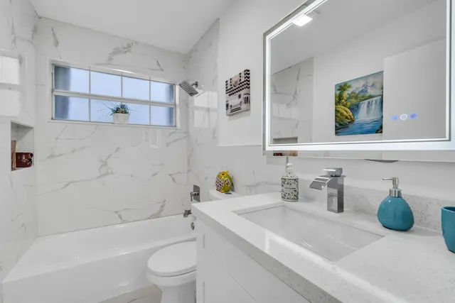 a view of a patio with table and chairs and potted plants