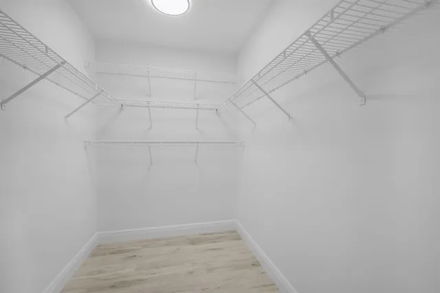 a view of a chairs and table in patio