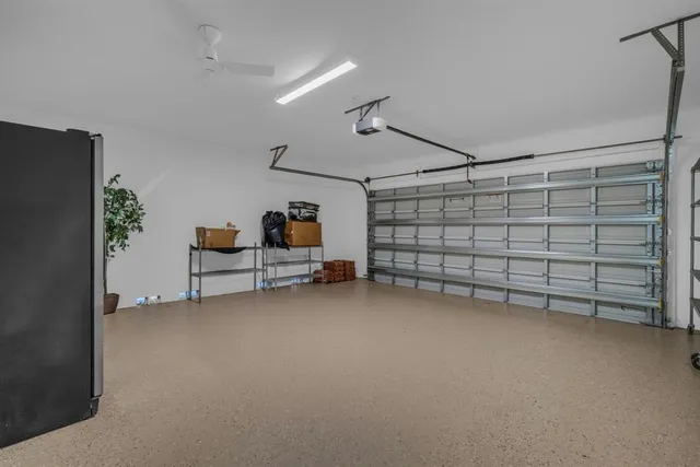 a view of a patio with a table and chairs