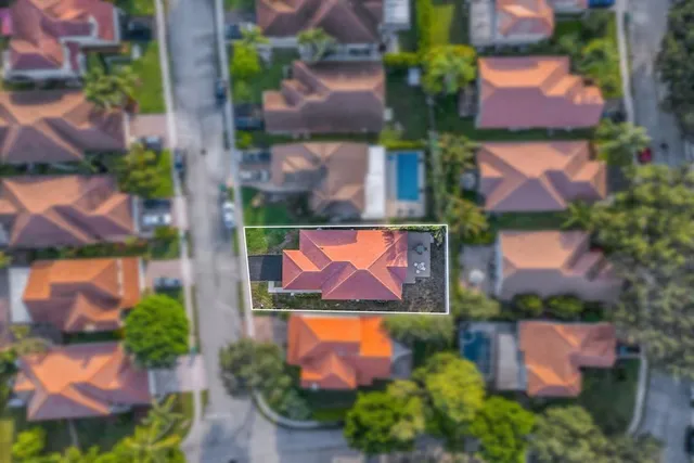 an aerial view of residential houses with city view and buildings