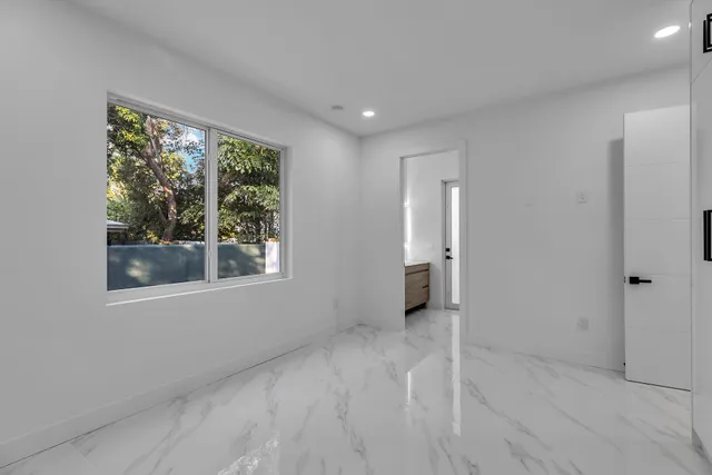 a bathroom with a shower and a toilet