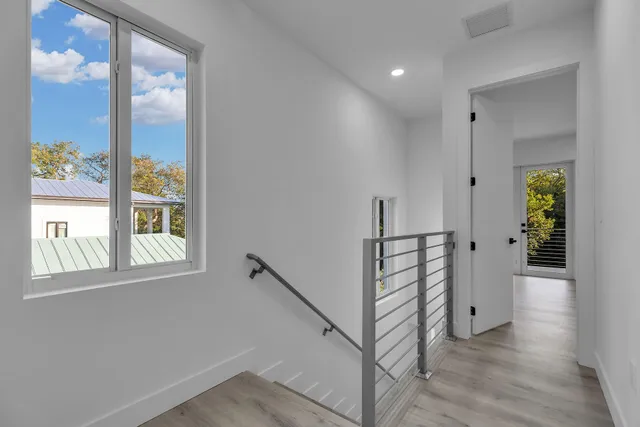 a view of room with window and hardwood floor