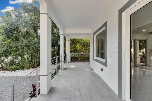 a view of a porch with backyard and garden