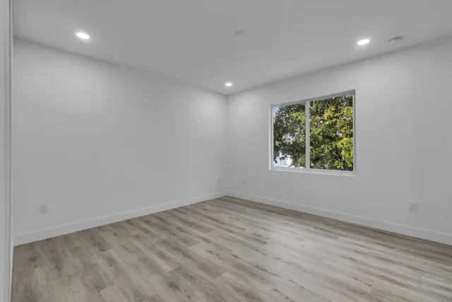 a bathroom with a shower and a sink