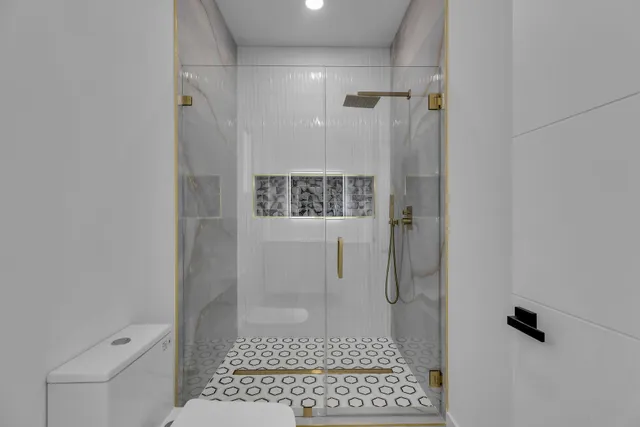 a view of a patio with table and chairs potted plants and large tree