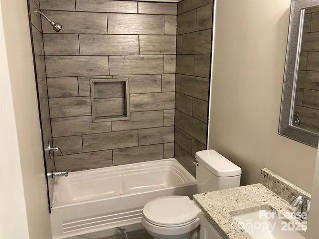 a bathroom with a toilet and shower