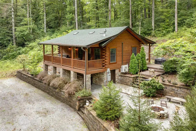 an aerial view of a house with a yard table and chairs