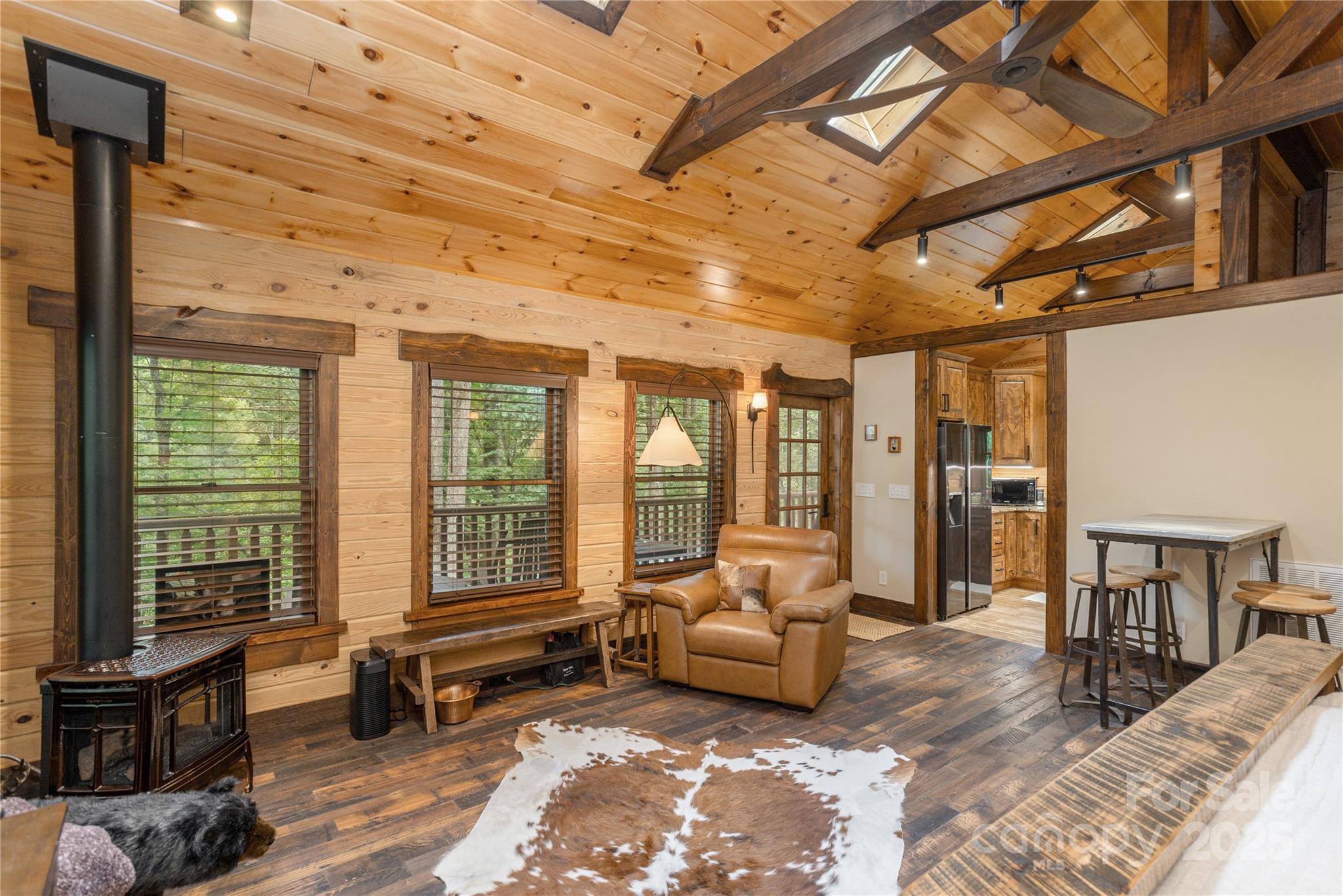 458 Rio Verde Drive Zirconia, NC 28790 - Photo 12 of 34 a living room with furniture and a large window