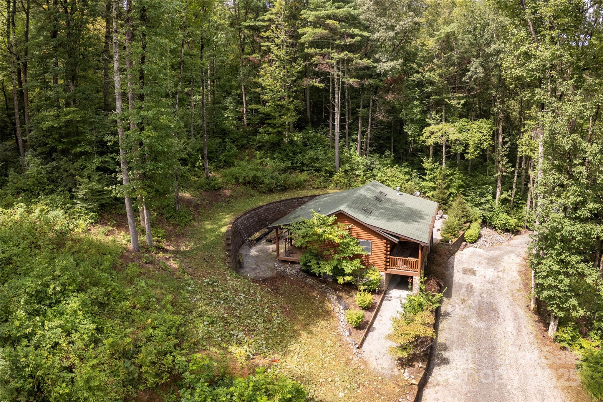458 Rio Verde Drive Zirconia, NC 28790 - Photo 18 of 34 a view of a house with a yard and sitting area