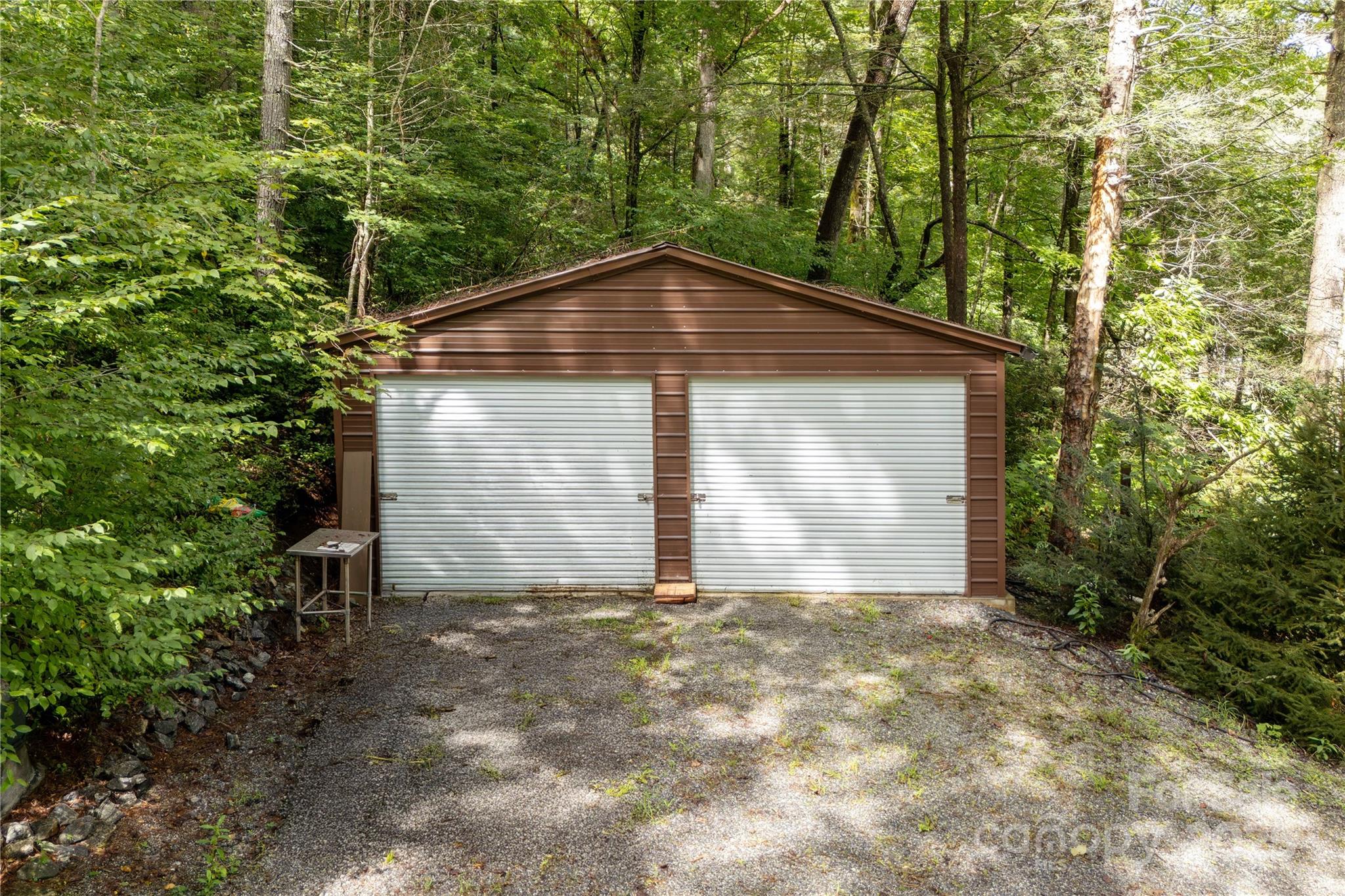 458 Rio Verde Drive Zirconia, NC 28790 - Photo 20 of 34 a front view of a house with a yard and garage