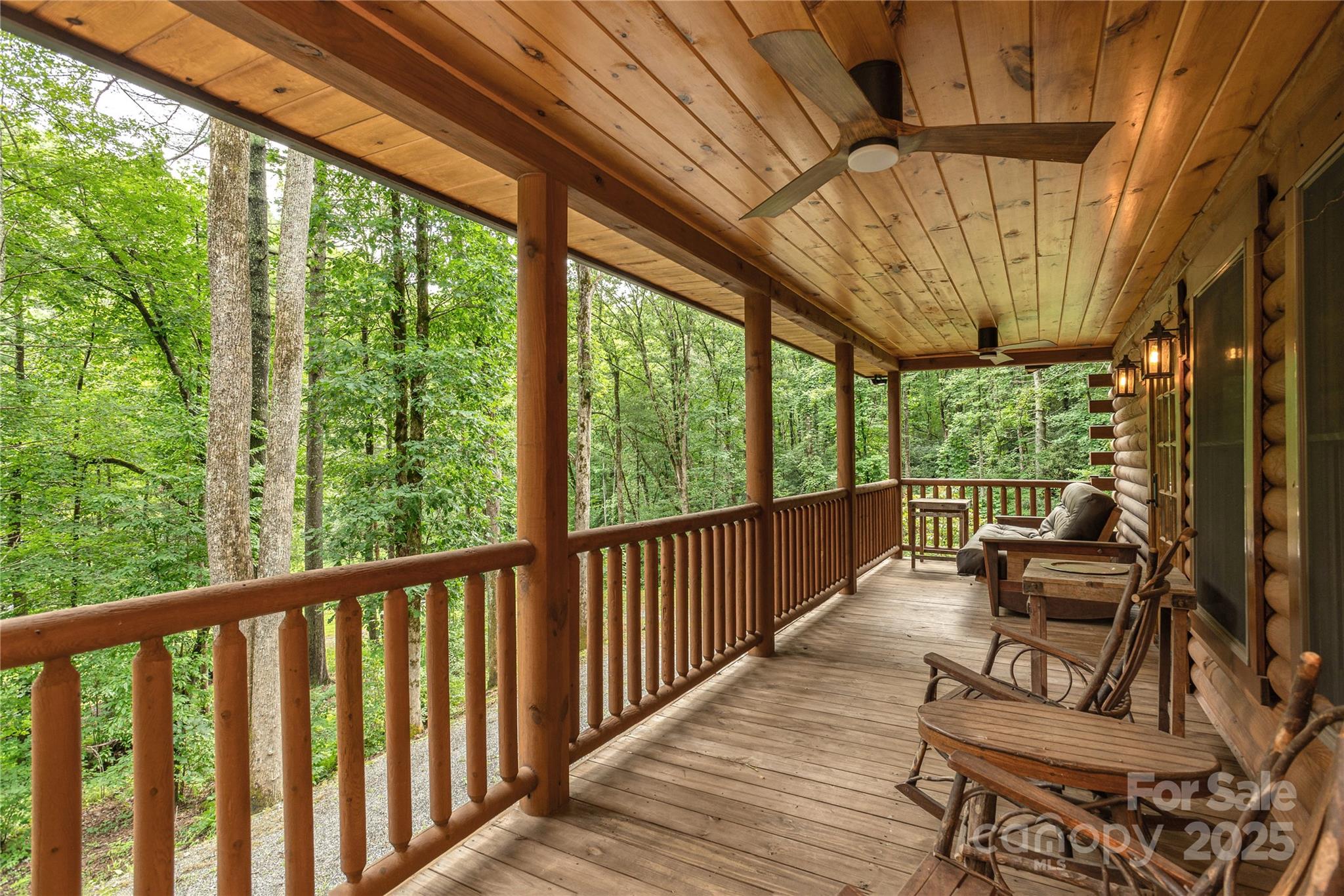 458 Rio Verde Drive Zirconia, NC 28790 - Photo 5 of 34 a balcony with wooden floor outdoor seating and furniture