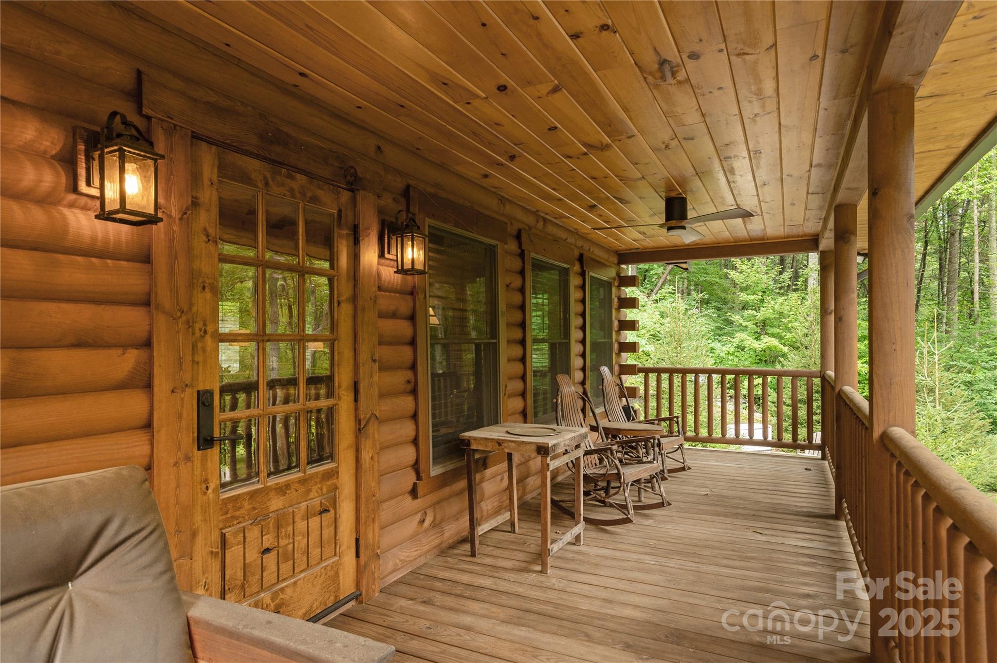 458 Rio Verde Drive Zirconia, NC 28790 - Photo 7 of 34 a view of a patio with a table chairs and wooden floor