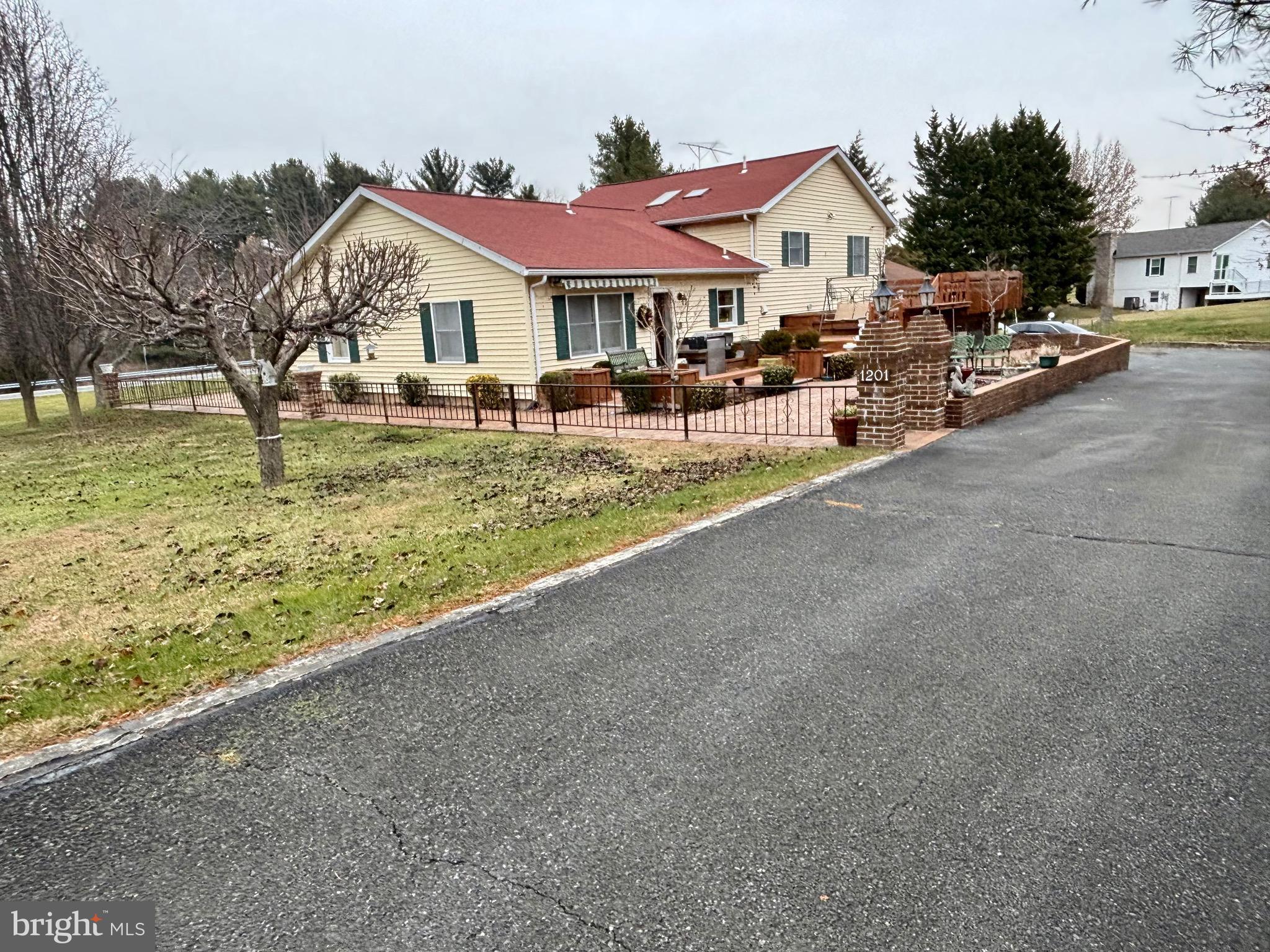 1201 Uniontown Road Westminster, MD 21158 - Photo 1 of 7 a front view of a house with a yard