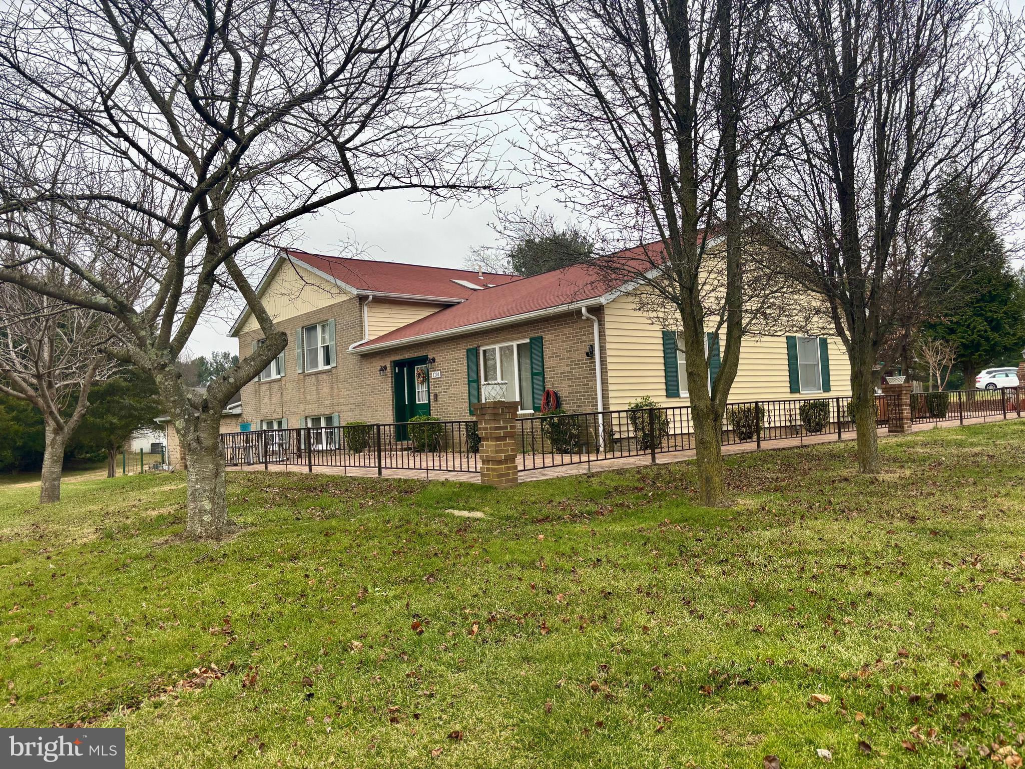 1201 Uniontown Road Westminster, MD 21158 - Photo 4 of 7 a view of a house with a yard patio and fire pit