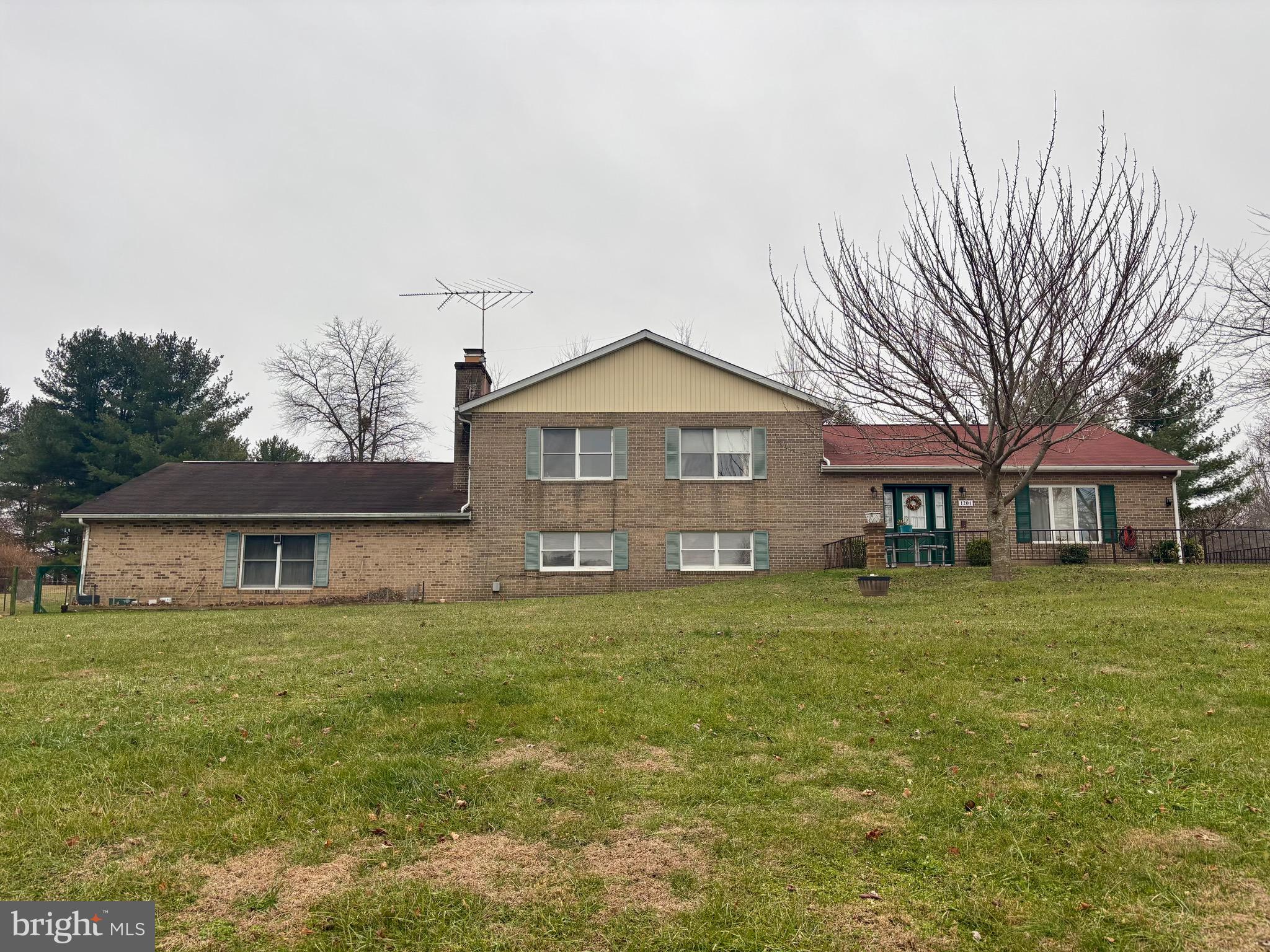 1201 Uniontown Road Westminster, MD 21158 - Photo 5 of 7 a front view of a house with a garden