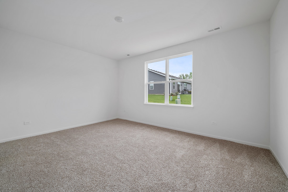 283 Ridley Street North Aurora, IL 60542 - Photo 12 of 40 an empty room with windows