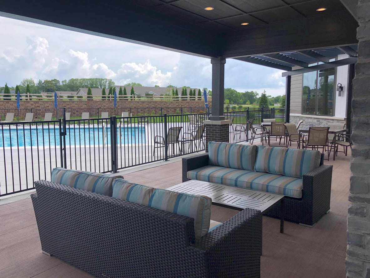 283 Ridley Street North Aurora, IL 60542 - Photo 20 of 40 a balcony with furniture and a floor to ceiling window