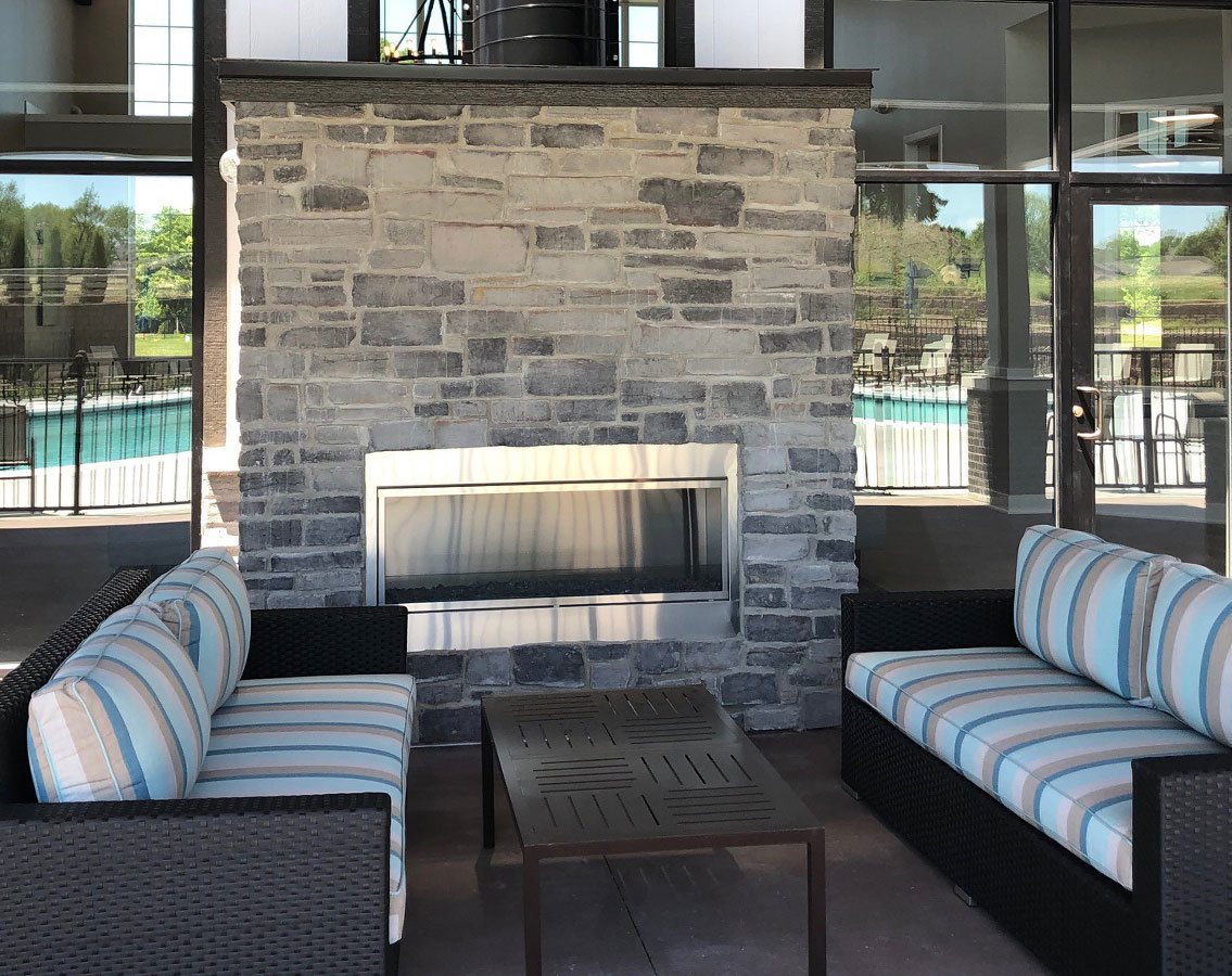 283 Ridley Street North Aurora, IL 60542 - Photo 22 of 40 a living room with furniture and a fireplace