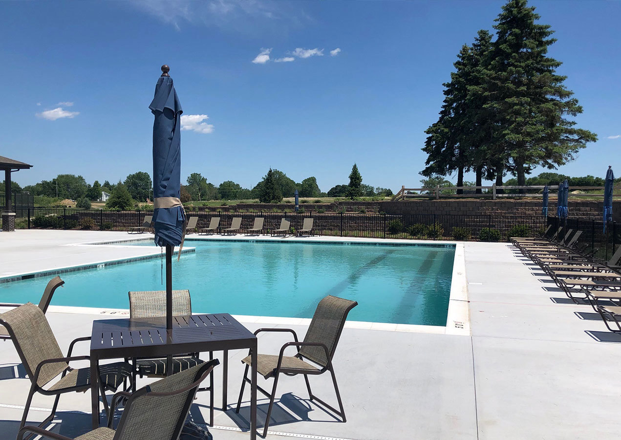 283 Ridley Street North Aurora, IL 60542 - Photo 24 of 40 a view of a lake with a table and chairs