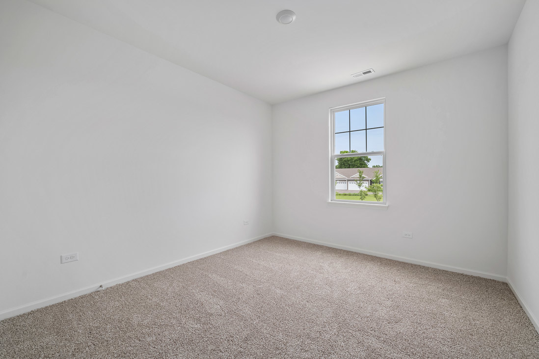 283 Ridley Street North Aurora, IL 60542 - Photo 3 of 40 an empty room with windows
