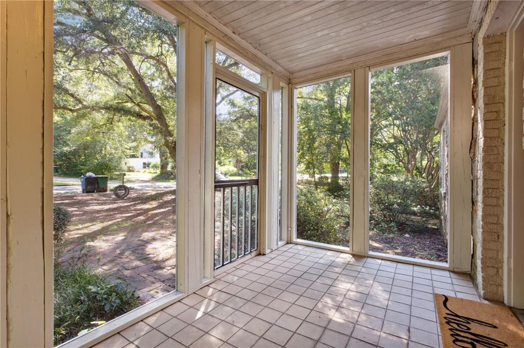 385 Sunset Drive Athens, GA 30606 - Photo 3 of 48 a view of a room with wooden floor and city from a window