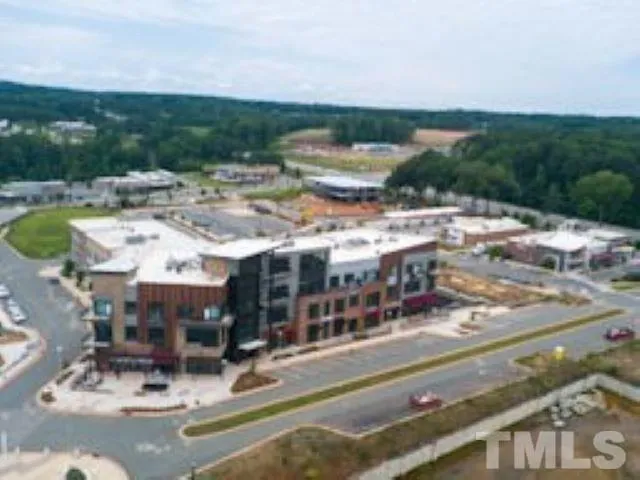 a view of building with outdoor space and swimming pool