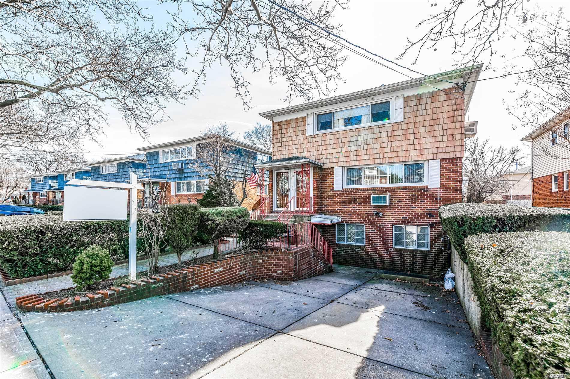 146-24 Willets Point Boulevard Queens, NY 11354 - Photo 1 of 1 a front view of a house with a garden