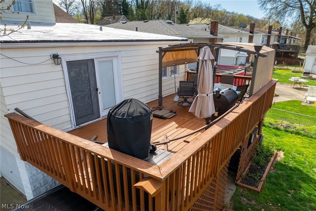 382 Baldwin Road Akron, OH 44312 - Photo 32 of 35 Wooden deck featuring a lawn