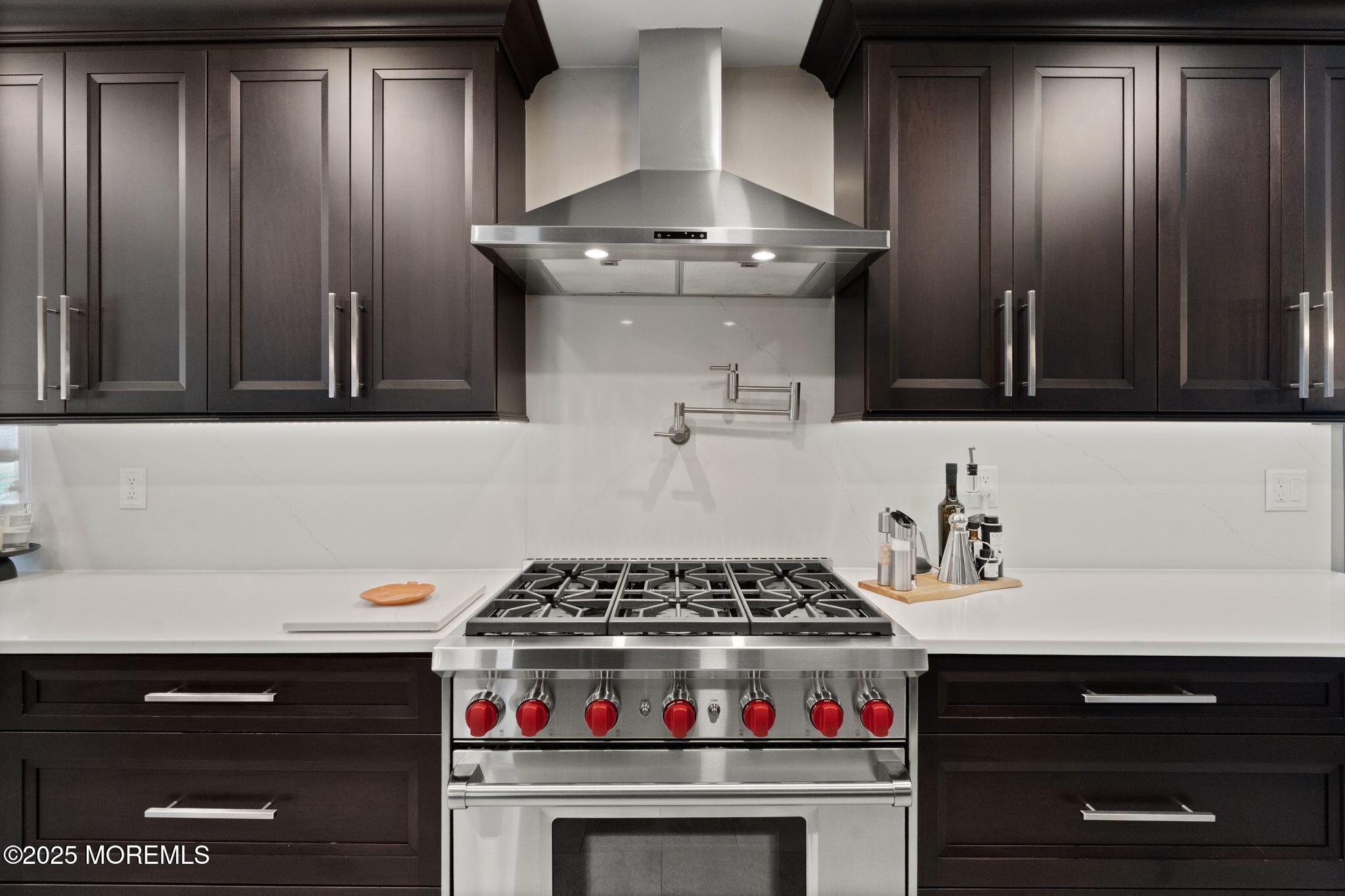 93 Wallace Road Middletown, NJ 07748 - Photo 11 of 47 a kitchen with a stove and a cabinets
