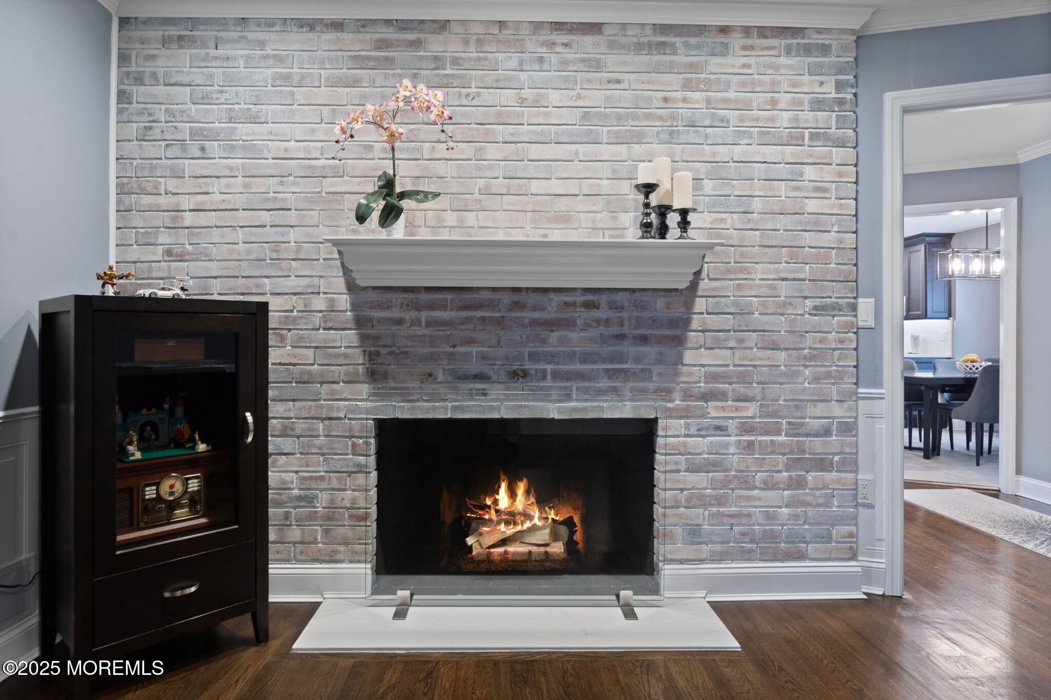 93 Wallace Road Middletown, NJ 07748 - Photo 17 of 47 a living room with furniture a fireplace and a wooden floor